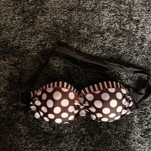 Pock-a-dot bikini top and black bottoms.